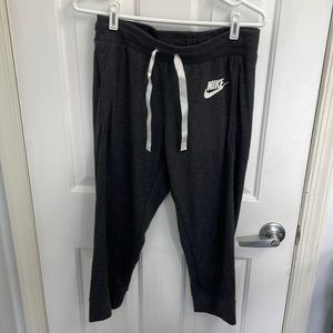 Unisex kids sweatpants by Nike size small. Gray with white logo and string ties